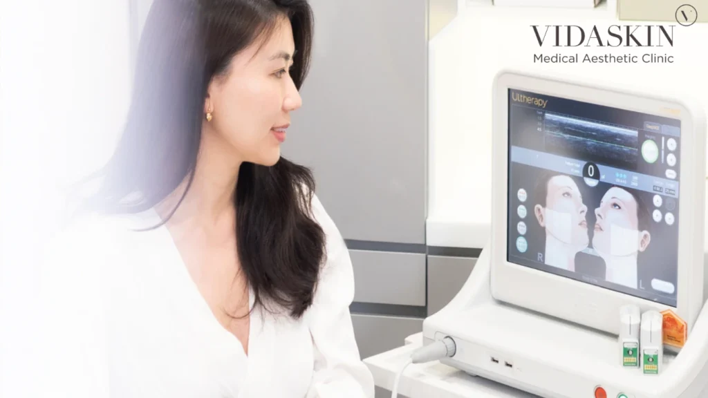 An aesthetic doctor using the Ultherapy see-plan-treat protocol to visualize tissue layers on a digital monitor during treatment.