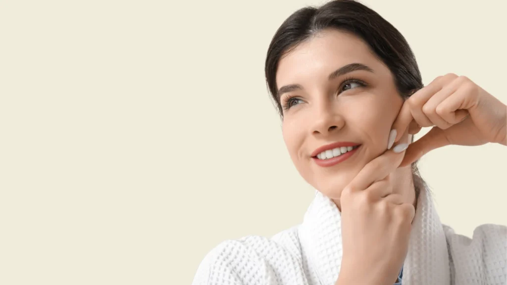 A model gesturing to a defined jawline, representing the improvement in early jowls and lower face definition.