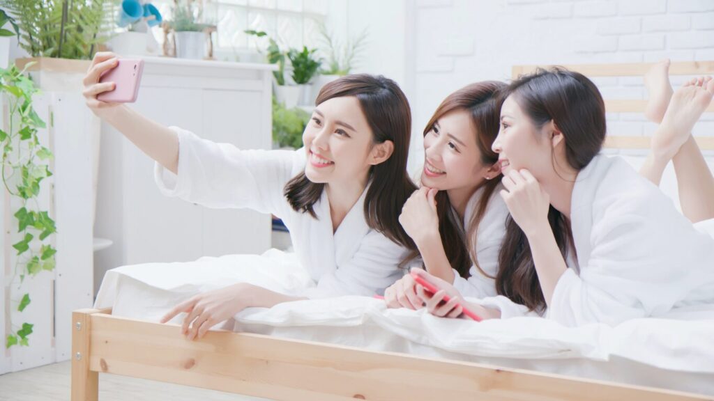 A group of women laughing together, representing the social confidence that comes from intimate comfort