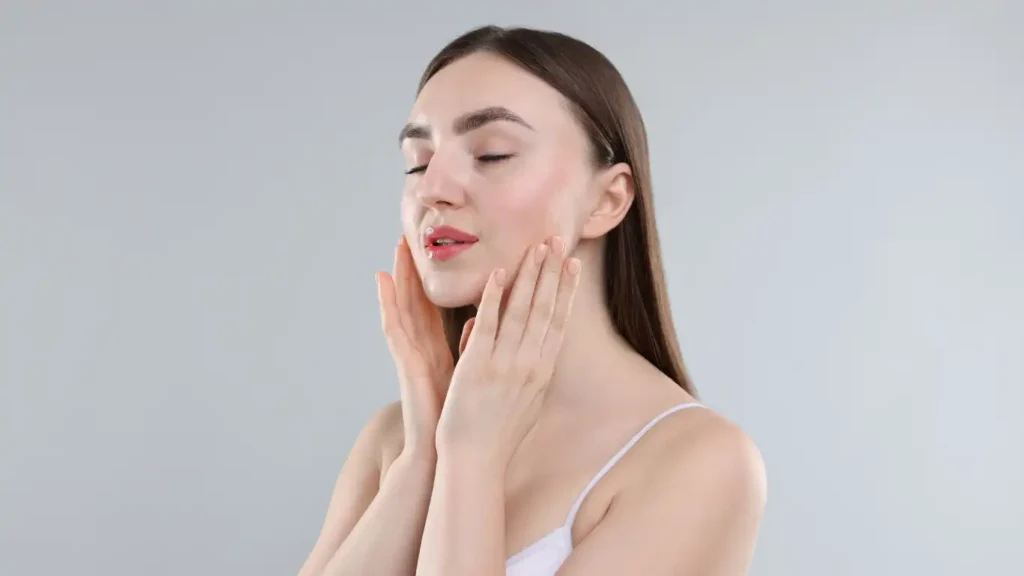 Woman holding her face