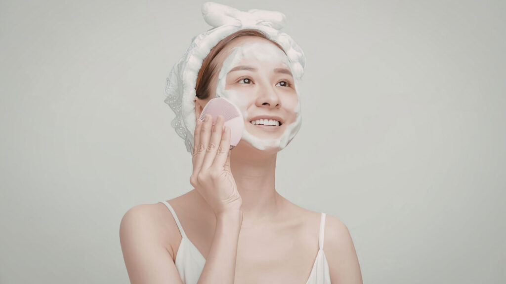 Woman washing her face