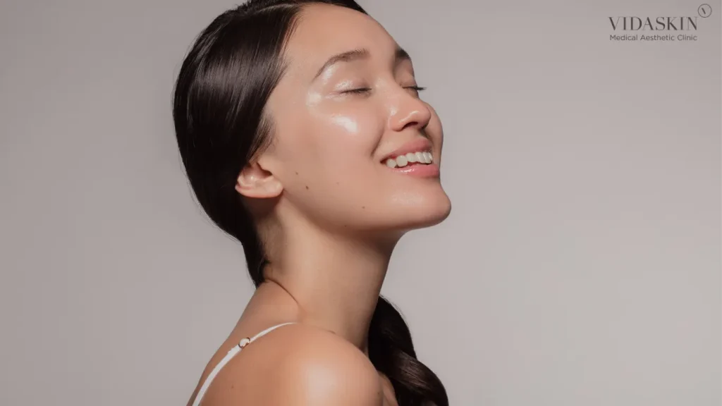 Side view of a woman looking up and into her left