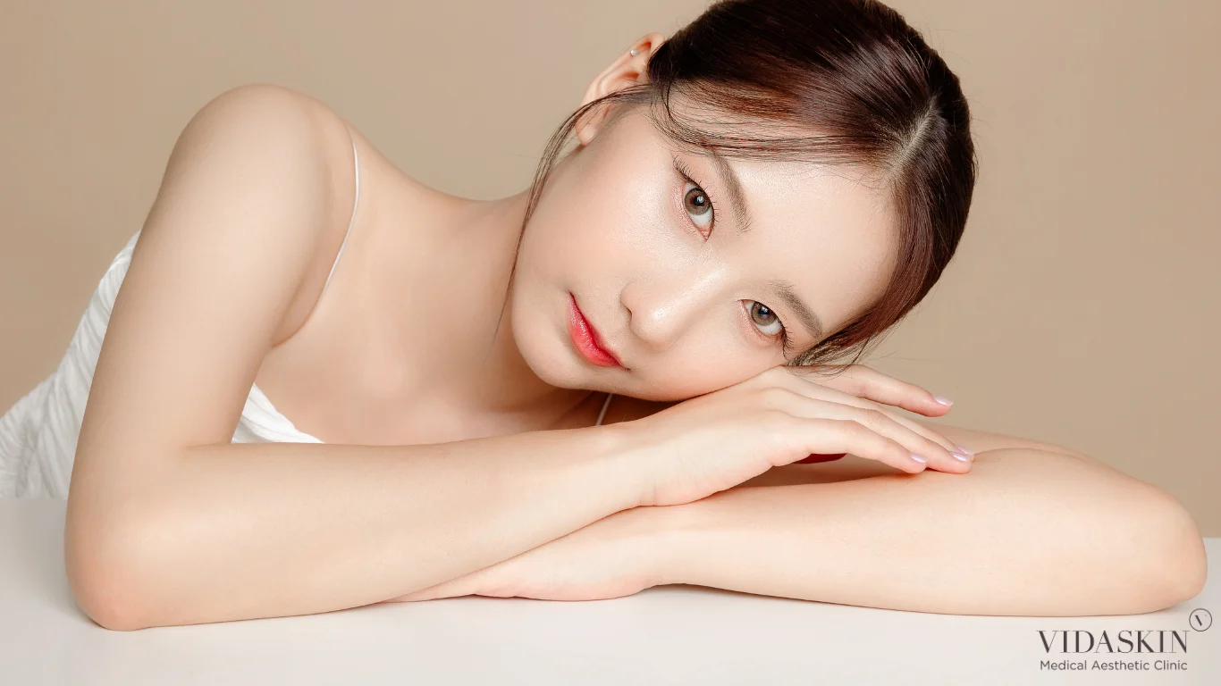 Woman lying on the side of her head on a table